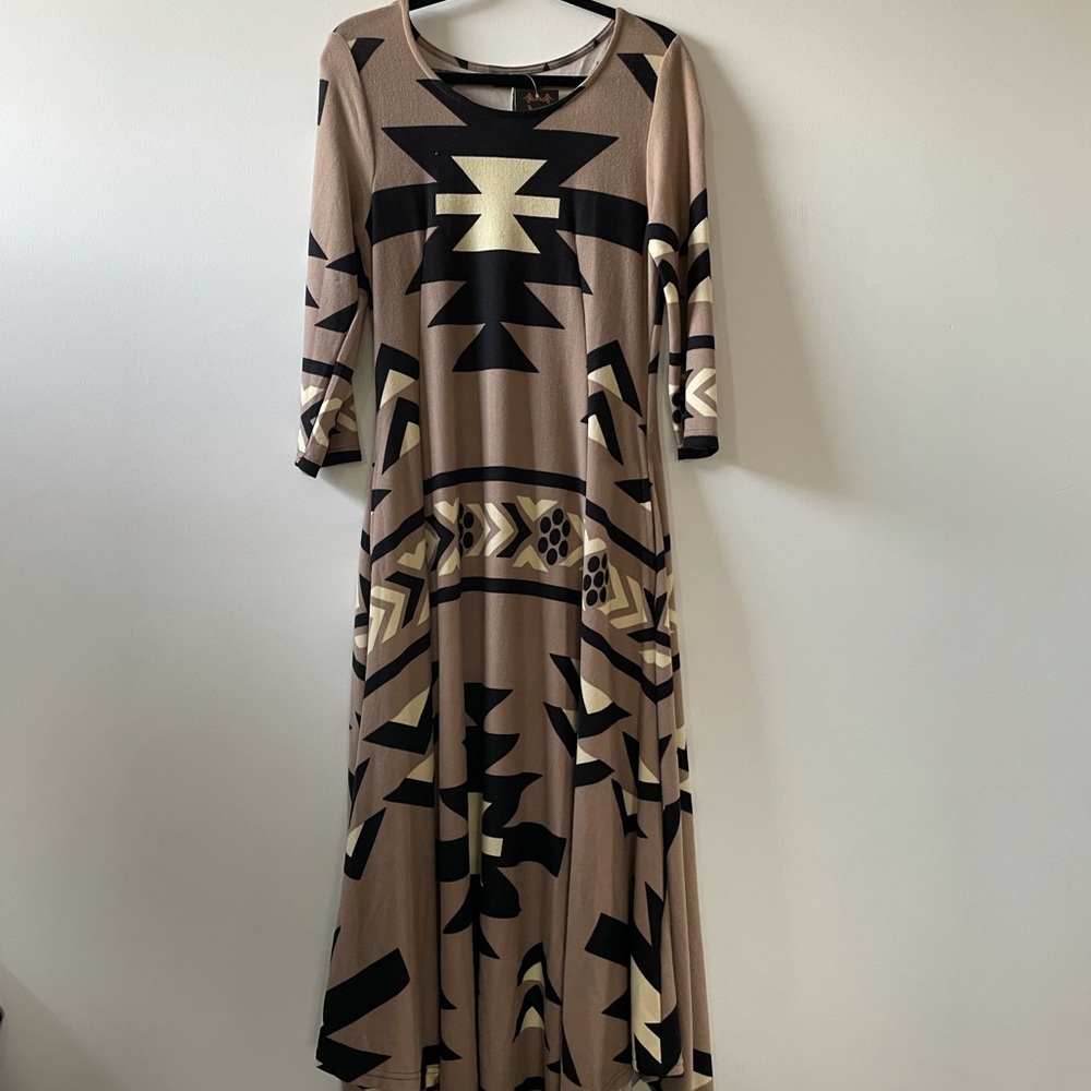 Long sleeve, full length, flowing dress perfect for for fall and winter.